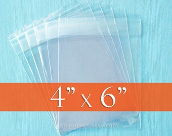 May include: Clear cellophane bags, measuring 4" x 6", are stacked on a light blue textured surface. The bags are transparent, allowing visibility of the contents. An orange banner across the image displays the dimensions.