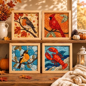 May include: Four square framed fabric wall art pieces featuring quilted designs. The top left shows a robin on a branch with autumn leaves, the top right a red cardinal, the bottom left a yellow and black bird, and the bottom right a red lobster.
