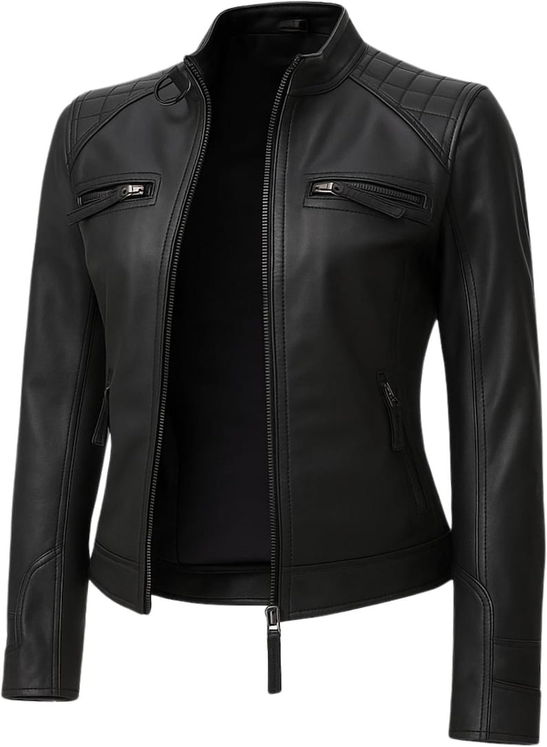 May include: A black jacket with a stand-up collar and a full-length front zipper. The garment features quilted shoulder panels, two zippered chest pockets, and two zippered side pockets. The sleeves have reinforced cuffs with horizontal stitching.