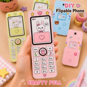 May include: A pink flip phone toy featuring a screen with a cartoon rabbit and a heart, a keypad with a paw print center button, and the text DIY Flipable Phone. Additional light green and blue toy phones are visible in the background.