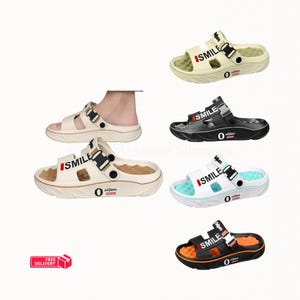 May include: A collection of slip-on sandals featuring a thick sole, a textured footbed, and two straps. The straps are printed with the word SMILE and a red accent. The side of the sole features the text 0 nijum. Available in beige, black, and white.