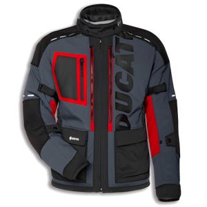 May include: A charcoal grey and black motorcycle jacket featuring bold red accents, a high collar, and the word DUCATI printed vertically in large black letters. The garment includes multiple zippered pockets, adjustable straps, and a Gore-Tex logo.