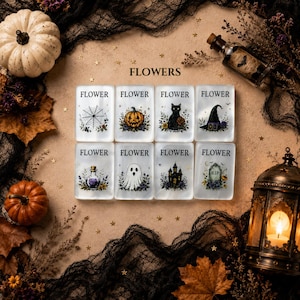 May include: Eight rectangular white tiles arranged in two rows, each labeled FLOWER. The designs feature a spider web, pumpkin, black cat, witch hat, potion bottle, ghost, haunted house, and tombstone, all surrounded by floral accents.