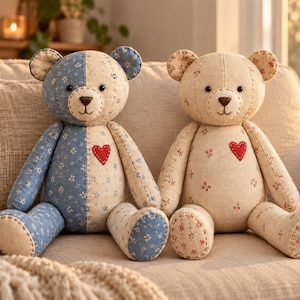 May include: Two stuffed teddy bears sitting side by side. The left bear features a split design with blue floral fabric on one side and cream floral fabric on the other. The right bear is cream with small floral patterns. Both have red heart patches.
