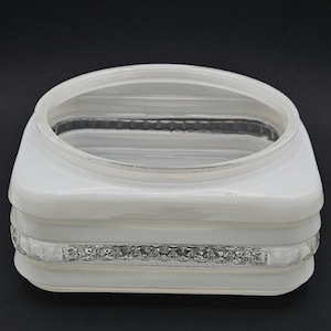 May include: A square glass light fixture shade featuring a white opaque finish with a clear, textured, diamond-patterned band running horizontally around the center. The top opening is circular with a smooth, clear glass rim.