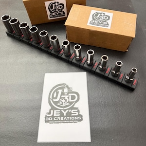 May include: A set of metal socket tools arranged on a black plastic organiser rail with red size labels ranging from 5mm to 19mm. Two brown cardboard boxes and a white card are present, each featuring the Jey's 3D Creations logo and text.