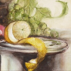 May include: A watercolor painting of a still life with a lemon, grapes, and a pink apple on a plate. The lemon is peeled and the peel is curled up on the plate. The grapes are green and the apple is pink.
