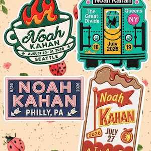 May include: Four embroidered patches featuring Noah Kahan concert designs. One is a coffee cup with flames, one a subway car, one a rectangular sign for Philly, and one a flag design for Atlanta, all with specific dates and locations included.