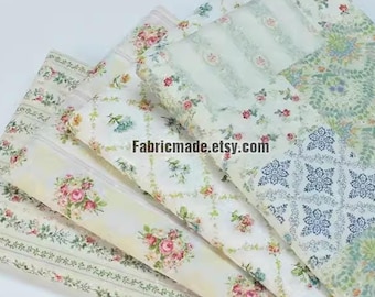 May include: Four pieces of fabric with floral and geometric patterns in shades of white, green, and pink. The fabric is perfect for quilting, crafting, or home decor projects. Fabricmade.etsy.com