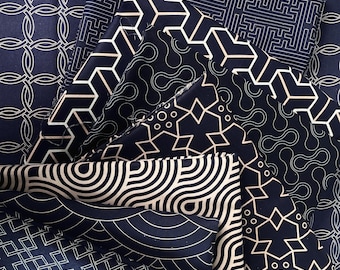 May include: A collection of dark navy blue fabric swatches featuring various white geometric patterns, including interlocking circles, angular maze-like lines, abstract organic shapes, star-like motifs, and concentric semi-circular wave designs.