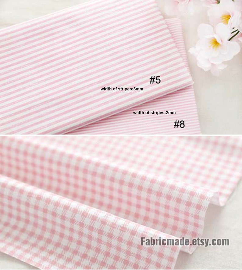 May include: Two pink and white striped fabrics with different stripe widths. The top fabric has stripes that are 3 mm wide and the bottom fabric has stripes that are 2 mm wide.  #5 and #8 are written on the fabrics.