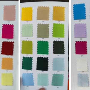 May include: A color chart with 50 fabric swatches, each labeled with a number. The swatches are arranged in rows of five, with each row featuring a different color scheme. The colors range from light to dark, and include shades of pink, red, orange, yellow, green, blue, purple, and brown.