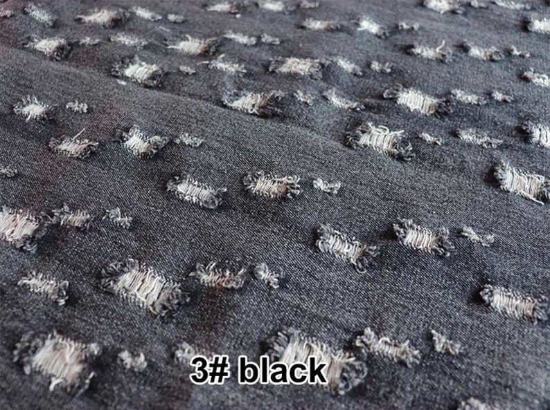 May include: Close-up of black denim fabric with a distressed, ripped look. The fabric has small, evenly spaced holes throughout, creating a unique and stylish texture. The text "3# black" is visible in the bottom right corner of the image.