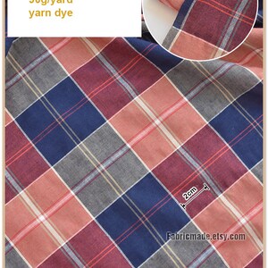 May include: Red, blue, and gray plaid fabric with a 2 inch measurement. The fabric is 100% cotton, 44 inches wide, and 90 grams per yard. The fabric is yarn dyed.