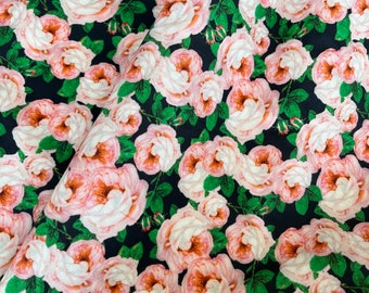 May include: A black fabric with a repeating pattern of pink and white roses with green leaves.