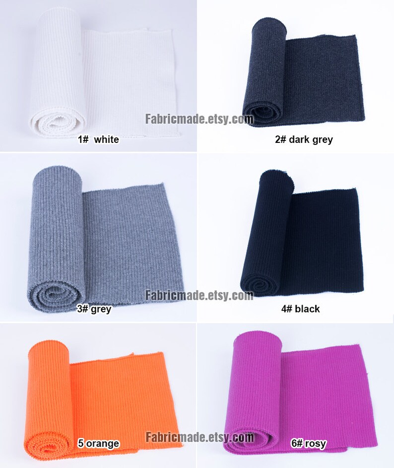 Op de afbeelding: Zes rollen geribbelde breisels in verschillende kleuren, waaronder wit, donkergrijs, grijs, zwart, oranje en roze. De stof is opgerold en op een witte achtergrond gelegd. De tekst "Fabricmade.etsy.com" is zichtbaar in de afbeelding.