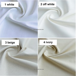 May include: Four fabric swatches in different shades of white: white, off-white, beige, and ivory. The swatches are arranged in a grid, with the white swatch in the top left corner, the off-white swatch in the top right corner, the beige swatch in the bottom left corner, and the ivory swatch in the bottom right corner.