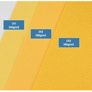 K&ouml;nnte beinhalten: Drei gelbe Stoffmuster mit unterschiedlichen Texturen und Gewichten. Die Muster sind mit ihrem Gewicht pro Quadratmeter gekennzeichnet: 1x1 240g/m2, 2x2 260g/m2 und 2x2 360g/m2.