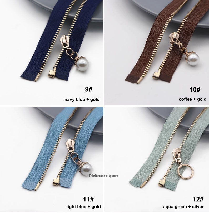 May include: Four different zipper pulls with different colors and finishes. The zipper pulls are all gold, but the fabric colors are navy blue, brown, light blue, and aqua green. The zipper pulls are labeled with numbers 9, 10, 11, and 12. The text below each zipper pull describes the color of the fabric and the finish of the zipper pull.