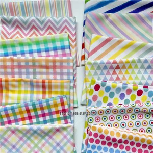 May include: A collection of colorful fabric swatches with various patterns, including stripes, zigzags, gingham, and polka dots. The fabrics feature a rainbow of pastel colors, perfect for crafting and sewing projects.