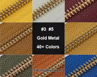 May include: Close-up of gold metal zippers in various colors, including yellow, white, red, brown, orange, and blue. The text "#3 #5 Gold Metal 40+ Colors Fabricmade.etsy.com" is visible in the center of the image.