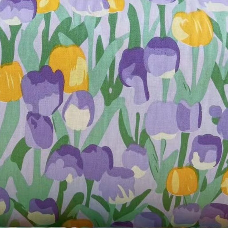 May include: A purple and yellow floral print fabric with a repeating pattern of stylized tulips. The background is a light purple color.
