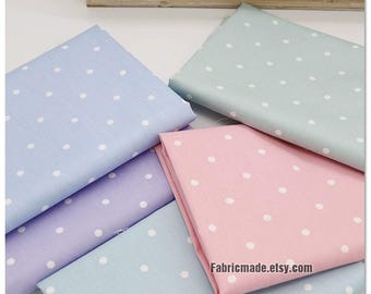 May include: Four fabric swatches with white polka dots on a light blue, light purple, pink, and mint green background. The fabric is folded and stacked on a wooden surface. The text "Fabricmade.etsy.com" is printed on the bottom right corner of the image.