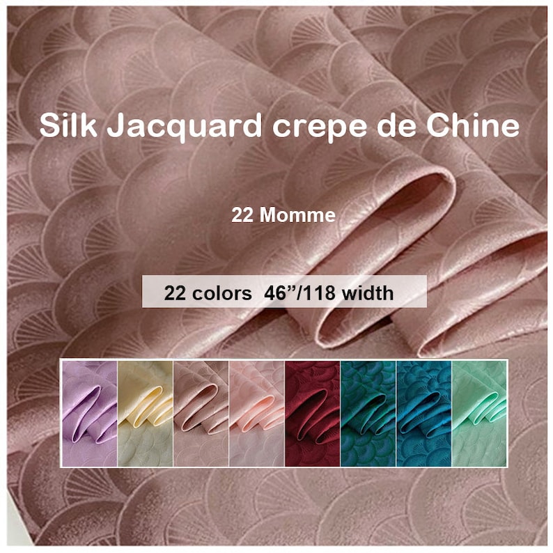 May include: A close-up of a pink silk fabric with a fan-shaped pattern. The fabric is labeled "Silk Jacquard crepe de Chine 22 Momme 22 colors 46"/118 width". A row of fabric swatches in various colors is shown below the main fabric.