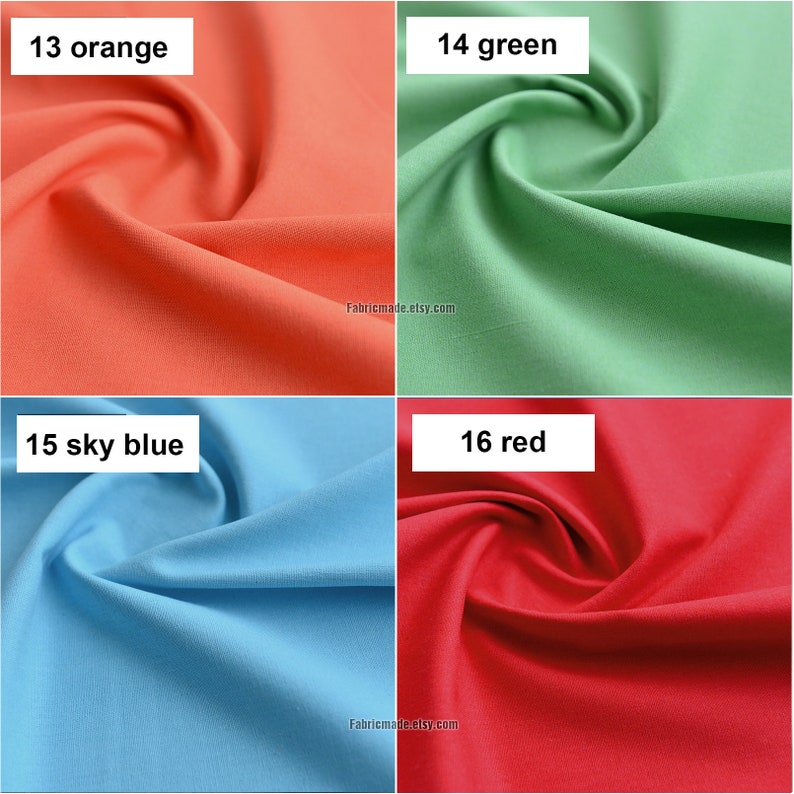 May include: Four fabric swatches in different colors: orange, green, sky blue, and red. The swatches are arranged in a grid pattern. Each swatch has a number and color name printed on it. The fabric is smooth and has a slight sheen.