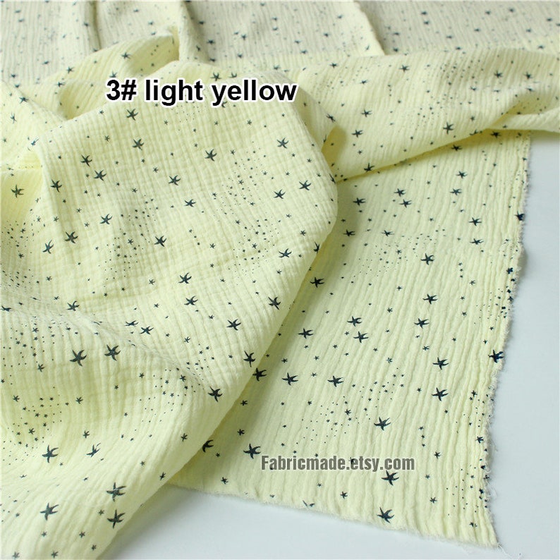 May include: Light yellow fabric with a star pattern. The fabric is a soft, textured material with a crinkled appearance. The text "3# light yellow" is visible in the image.