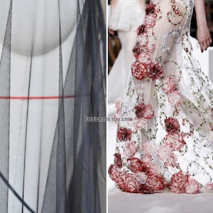 May include: Two pieces of sheer fabric. One is black and the other is white with red embroidered flowers. The white fabric has the text "Fabricmade.etsy.com" printed on it.