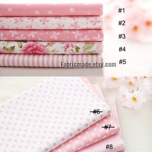 May include: Nine different pink and white fabric swatches with various patterns, including polka dots, stripes, and floral designs. The swatches are numbered 1 through 9.