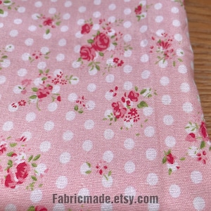 May include: Pink fabric with a white polka dot pattern and a floral print featuring small red roses. The fabric is folded in half and the text "Fabricmade.etsy.com" is visible in the bottom right corner.