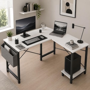 May include: An L-shaped white desk with a black metal frame, featuring a side storage pocket, a computer monitor, a laptop, a keyboard, a mouse, a desk lamp, a clock, and a black computer tower placed on a lower shelf of the desk structure.