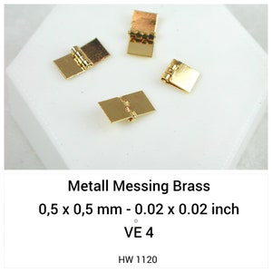 May include: Four small gold-colored brass hinges, each measuring 0.02 x 0.02 inches. The hinges are rectangular with a central pivoting barrel and flat plates on either side. The text on the image reads Metall Messing Brass, 0.5 x 0.5 mm - 0.02 x 0.02 inch, VE 4, HW 1120.