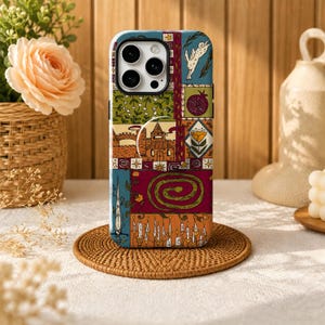 May include: A smartphone case featuring a multi-panelled graphic design with illustrations of a rabbit, a pomegranate, a castle, a flower, a coiled snake, a sword, and a row of lit candles in shades of blue, green, orange, and deep red.