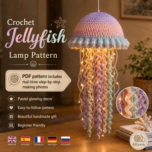 May include: A crochet jellyfish lamp with a pastel gradient dome and long, spiraling tentacles in shades of pink, purple, and blue. The jellyfish is illuminated by warm string lights woven through the yarn, hanging as a decorative piece.