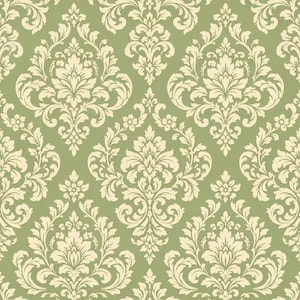 May include: A seamless wallpaper pattern featuring a repeating damask motif in cream-colored ink printed on a solid sage green background. The design consists of symmetrical, ornate floral and leaf shapes arranged in a structured grid layout.