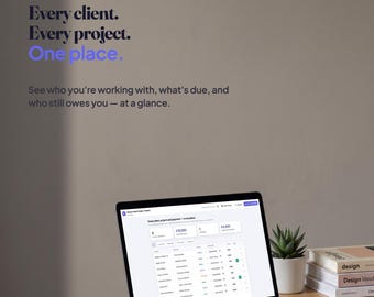 May include: A laptop displaying the Plotline software interface on a wooden desk. The screen shows a project management dashboard with client data. Text on the wall reads: Plotline. Every client. Every project. One place. See who you're working with, what's due, and who still owes you — at a glance.
