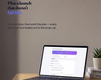 May include: A laptop displaying the Plotline interface on a wooden desk. The screen shows a project management dashboard with a countdown timer and task list. Text on the wall reads: Plotline, Plan a launch that doesn't fall flat.