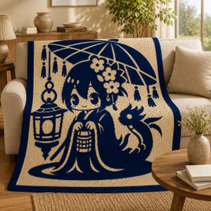 May include: A rectangular throw blanket featuring a dark blue graphic design on a beige background. The illustration depicts a character with flowers in their hair, holding a small lantern under an umbrella, accompanied by a stylized creature.