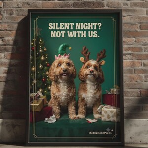 May include: A framed poster featuring two brown dogs sitting in front of a Christmas tree and gifts. One dog wears a green and red elf hat, the other wears brown reindeer antlers. The text reads: SILENT NIGHT? NOT WITH US. The Big Mood Pup Co.