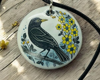Handmade Blackbird Pendant: Earthenware Clay Necklace, Floral Design