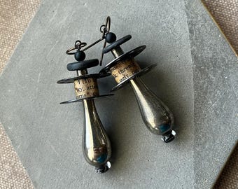 assemblage narrative text earrings with vintage sewing bobbins and metal raindrop beads by Anvilartifacts