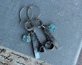 asymmetrical textured sterling silver earrings adorned with artisan Roman glass by AnvilArtifacts