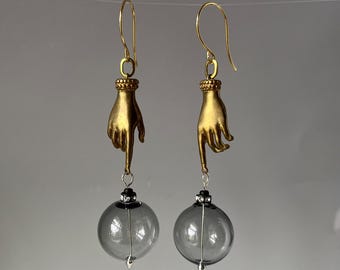 bronze hands with clear grey blown glass bead earrings  by AnvilArtifacts, hand jewelry