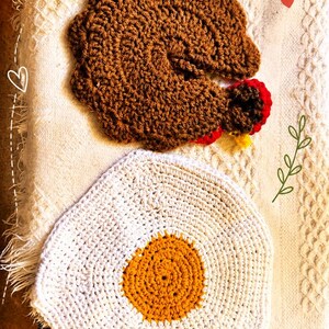 May include: A brown crocheted turkey and a white and yellow crocheted fried egg. Text reads: Handmade with Love, Crocheted with care, made to MAKE YOU SMILE!, and Alices ADORABLES Handmade Crocheted Goods. The items are textured and circular in shape.