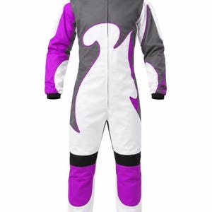 May include: A full-body jumpsuit featuring a high collar and a front zip closure. The garment is designed with a colour-blocked pattern in white, grey, and vibrant purple, including curved white panels on the torso and purple sections on the legs.