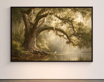 May include: A framed landscape wall art print featuring a large, ancient oak tree with hanging Spanish moss beside a calm river. A single white egret stands on the muddy bank. The scene is bathed in soft, golden sunlight filtering through trees.