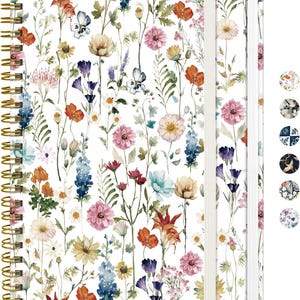 May include: A spiral-bound notebook with a white cover featuring a colorful watercolor floral pattern of various wildflowers in shades of pink, orange, blue, and yellow. The notebook includes a white elastic closure band and six small circular color swatches.